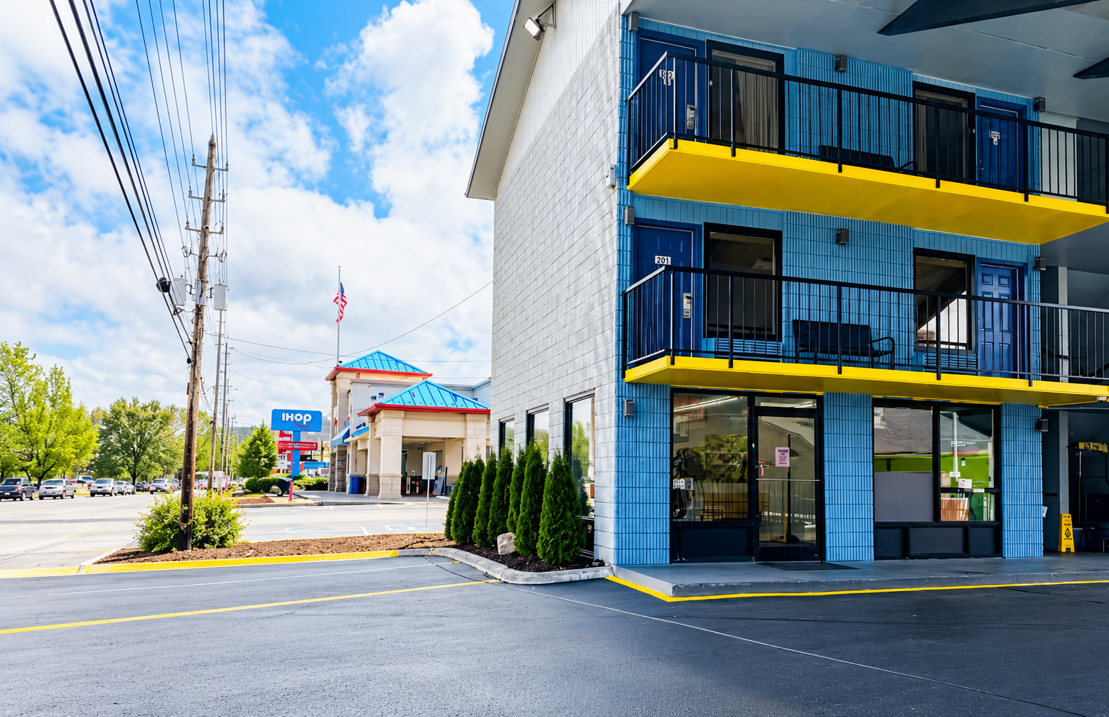 Briarstone Inn exterior with blue walls and yellow balconies on the Parkway